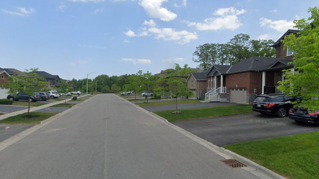 Bishop Drive residential streetscape with curbs, detached homes, and driveway entrances