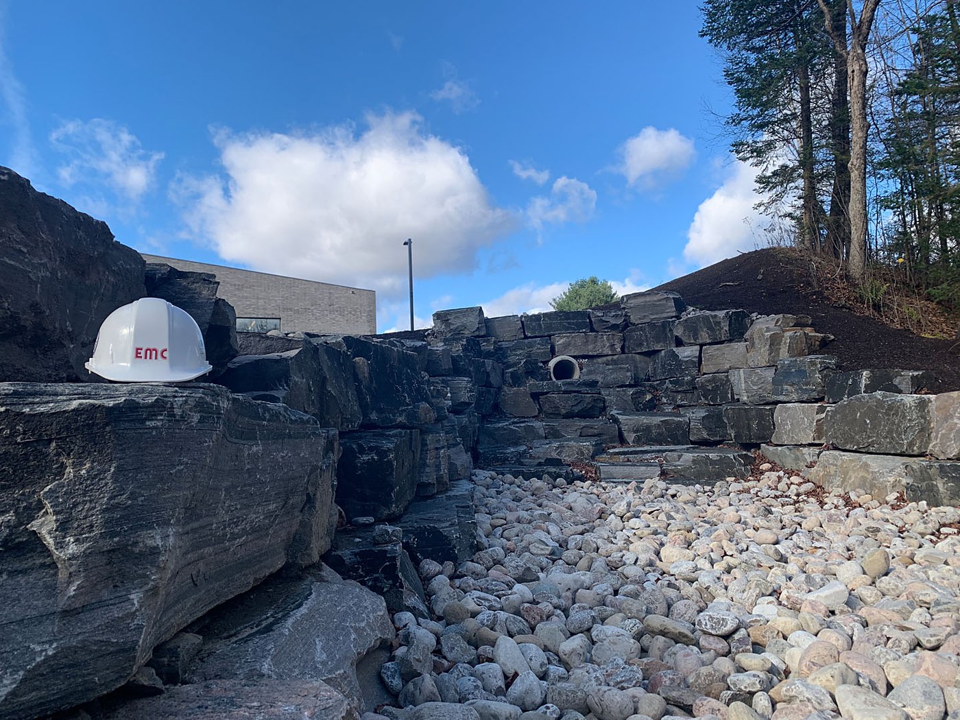 SWM retaining wall with stone outfall and EMC hardhat