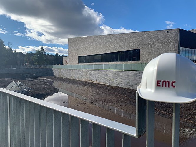 EMC hardhat overlooking SWM pond and building