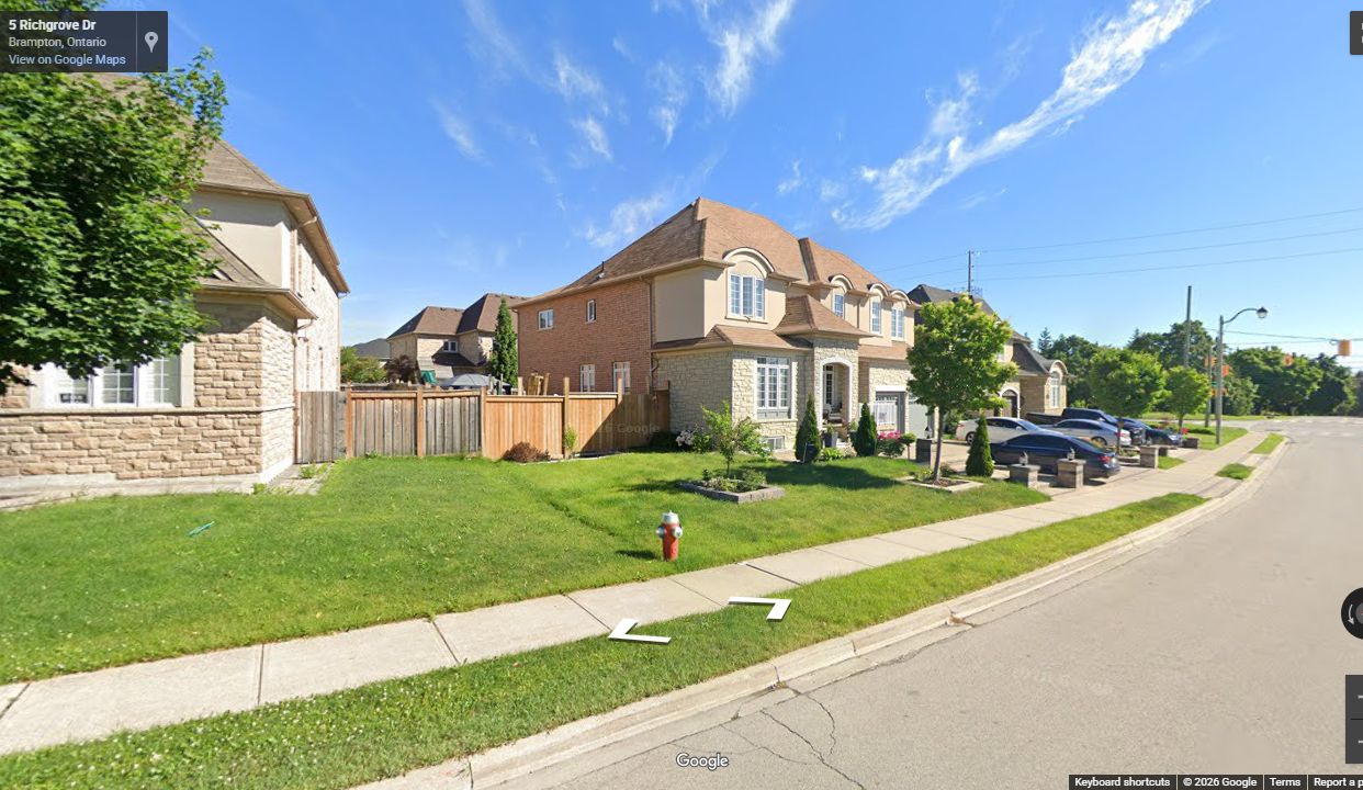 Completed Castlemore South residential streetscape with curbs, sidewalks, driveways, and finished homes