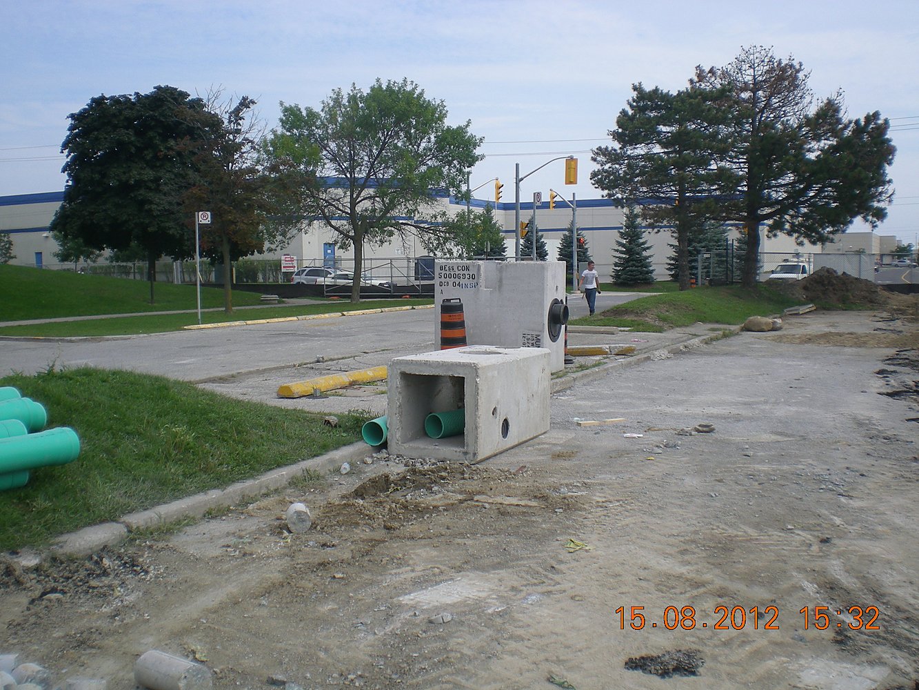 Concrete catch basin and storm pipe installation at Centennial College campus