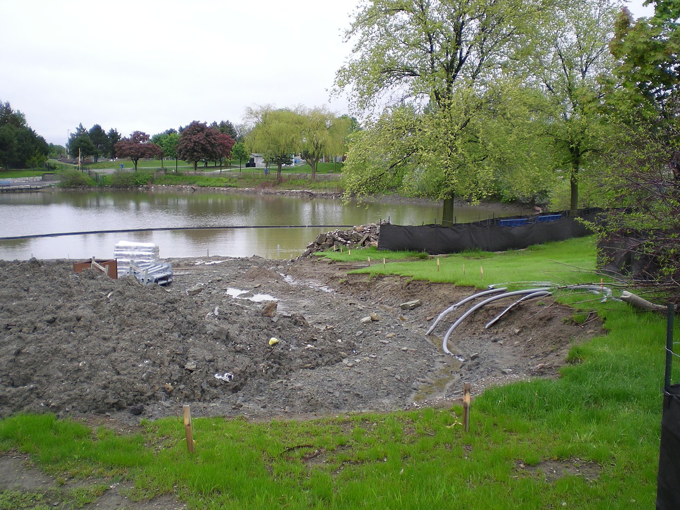 Pond edge construction with mature landscaping at Chinguacousy Park