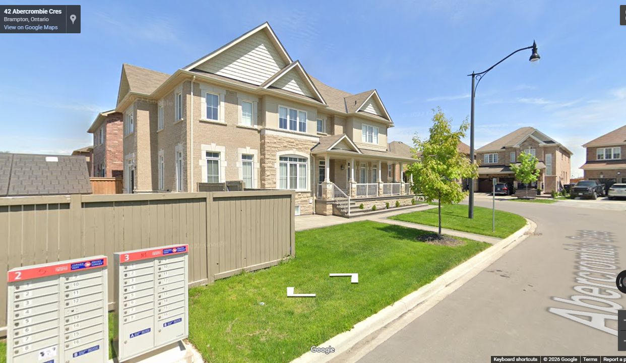 Completed Fanshore East residential street with curb, sidewalk, landscaping, and finished homes