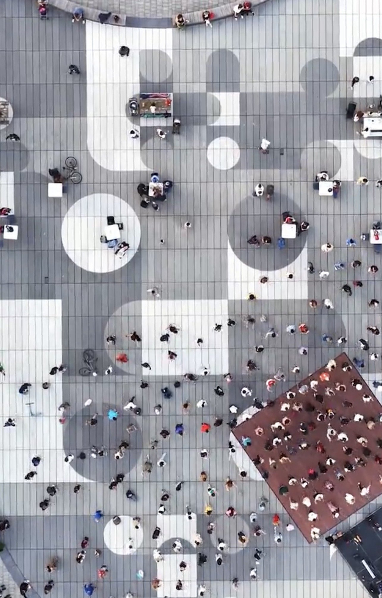 Harbourfront Centre Community Square – Drone view of the paved plaza with visitors, movable seating and a dance floor
