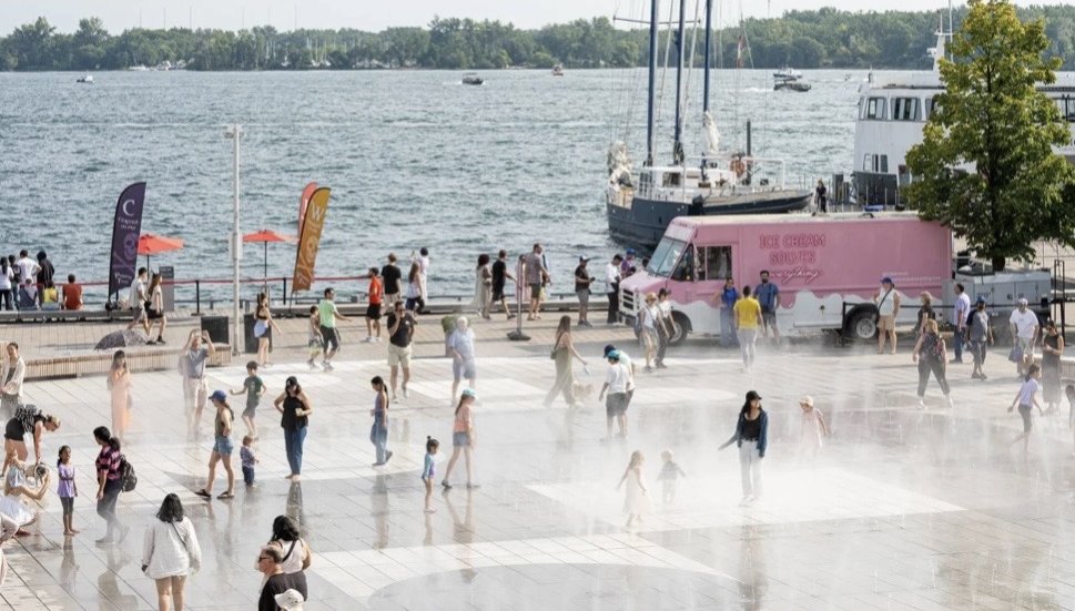 Harbourfront Centre Community Square – Crowds in the fog feature with the harbour, boats and an ice cream truck behind
