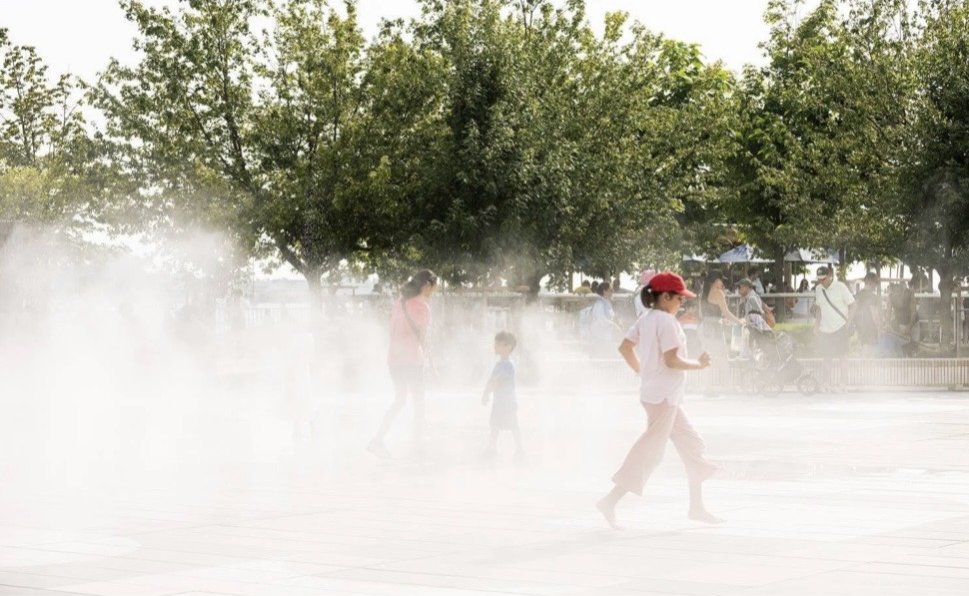 Harbourfront Centre Community Square – Visitors running through fog beneath the trees at the edge of the plaza