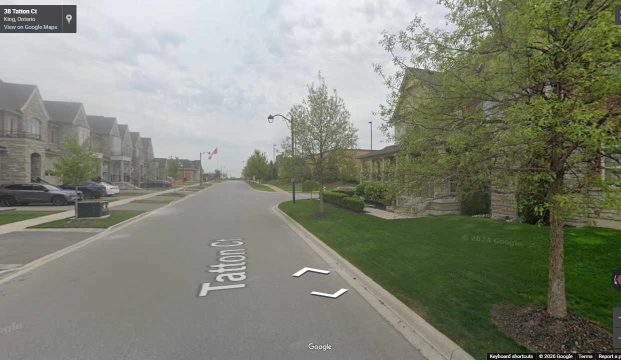 Completed King North residential street with curbs, sidewalks, landscaping, and finished homes