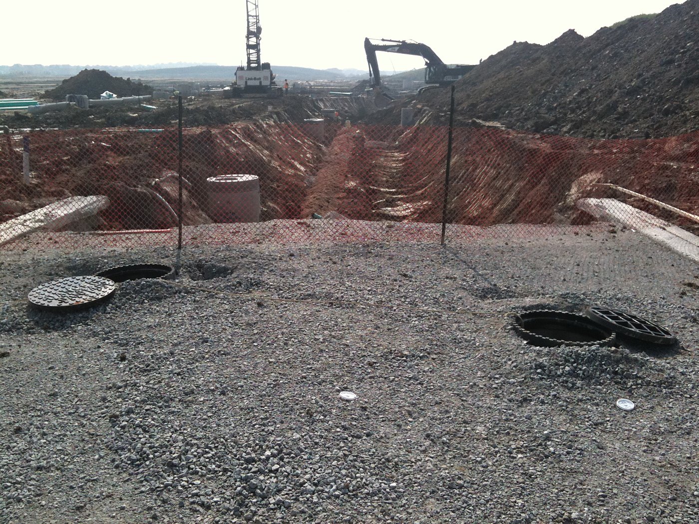 Stormwater management pond excavation with crane