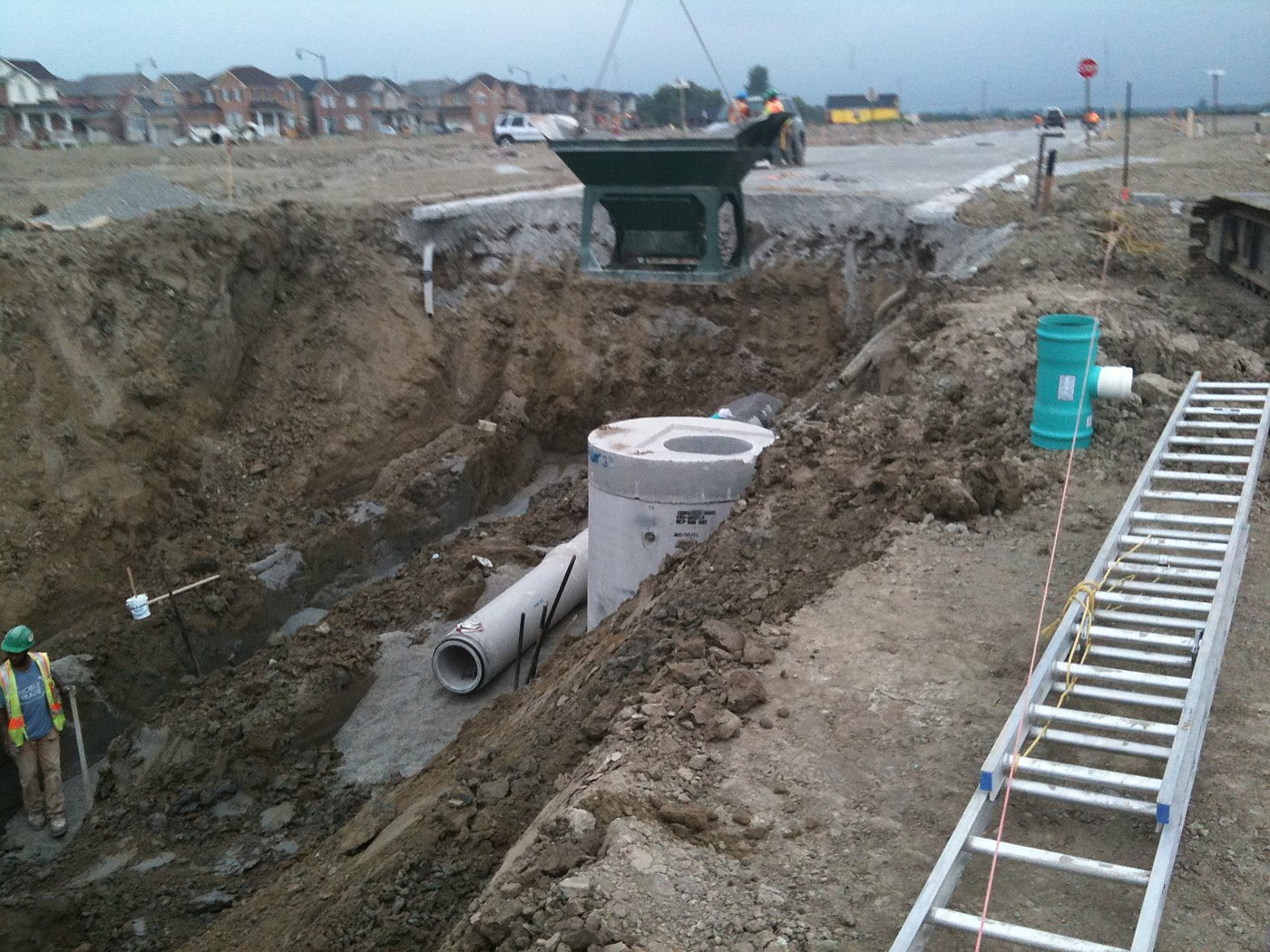 Site servicing overview with equipment and grading operations