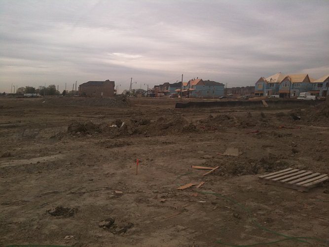Subdivision grading with homes under construction