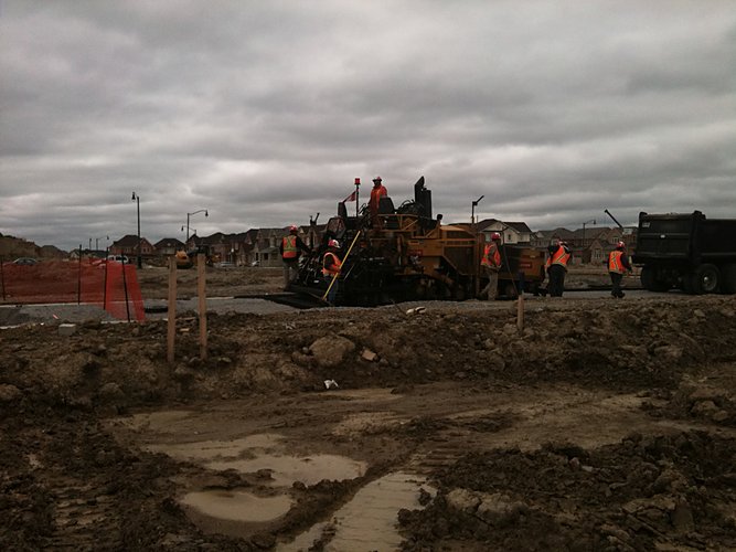 Site servicing with equipment along roadway