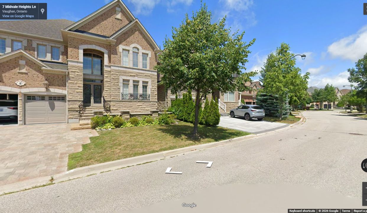 Completed Midvale Teston estate street with curbs, landscaping, driveways, and finished homes
